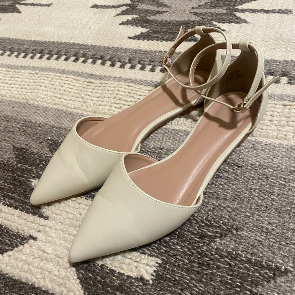 White pointed toe flats with ankle strap